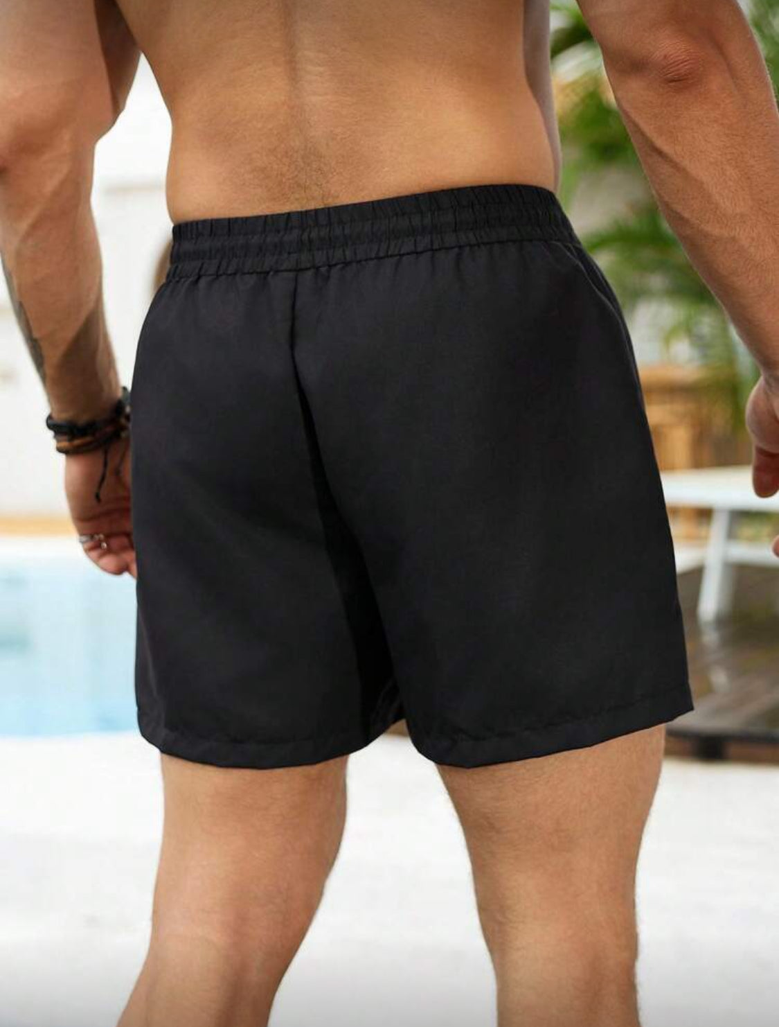 Manfinity Swimmode Shorts casuales de playa para hombres, con estampado de palmeras tropicales verdes, cintura elástica con cordón, pantalones de playa versátiles y de moda para el verano