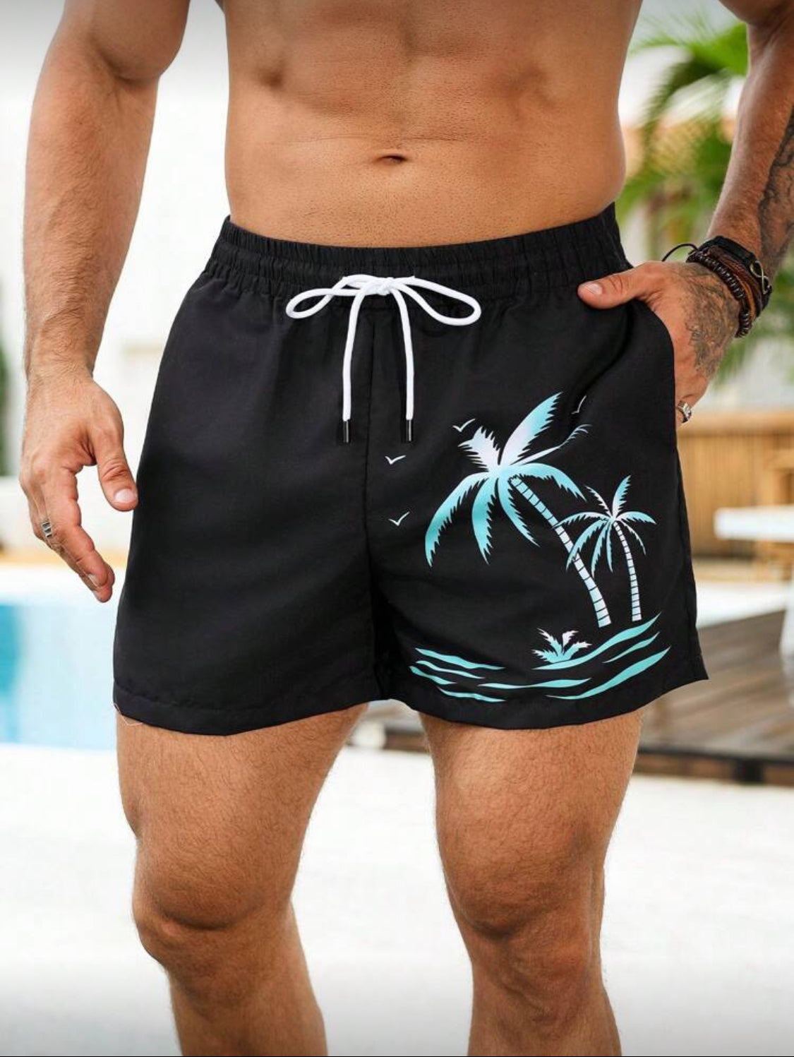 Manfinity Swimmode Shorts casuales de playa para hombres, con estampado de palmeras tropicales verdes, cintura elástica con cordón, pantalones de playa versátiles y de moda para el verano