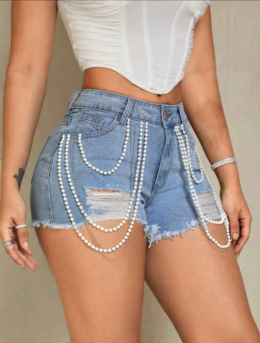 SHEIN SXY Pantalones cortos de mezclilla rasgados con dobladillo crudo y cuentas de perlas falsas